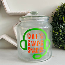 Load image into Gallery viewer, personalised gaming snack jar with lid, headphone image with name's gaming snacks on the front