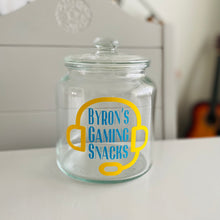 Load image into Gallery viewer, personalised gaming snack jar with lid, headphone image with name's gaming snacks on the front
