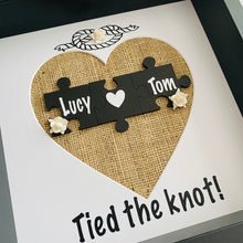 Load image into Gallery viewer, framed wedding gift with names on jigsaw pieces cream roses and tied the knot text