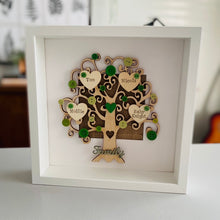 Load image into Gallery viewer, wooden family tree with names on hearts and coloured buttons in a frame
