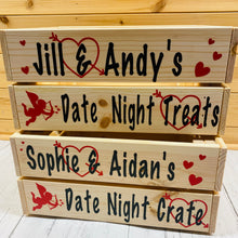 Load image into Gallery viewer, Wooden crate with your names and date night treats on it with hearts and cupid