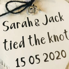 Load image into Gallery viewer, cream tied the knot hanging heart personalised with couples names with black bow