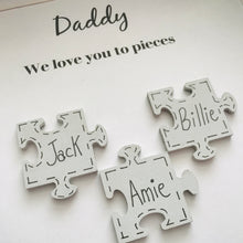 Load image into Gallery viewer, box frame with names on jigsaw pieces and daddy/mummy we love you to pieces