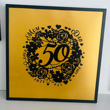 Load image into Gallery viewer, black floral wreath image with 50 in the middle and a gold background with wedding anniversary details around the wreath in black frame
