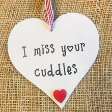 Load image into Gallery viewer, hand painted heart with I miss your cuddles text and gingham ribbon hanger