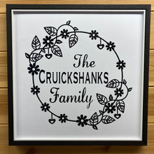 Load image into Gallery viewer, black framed picture with family name in floral wreath