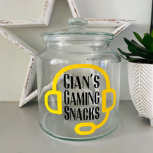 Load image into Gallery viewer, personalised gaming snack jar with lid, headphone image with name&#39;s gaming snacks on the front
