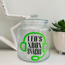 Load image into Gallery viewer, personalised gaming snack jar with lid, headphone image with name&#39;s gaming snacks on the front
