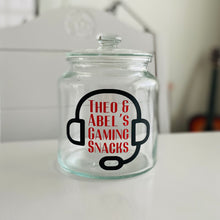 Load image into Gallery viewer, personalised gaming snack jar with lid, headphone image with name&#39;s gaming snacks on the front
