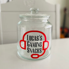 Load image into Gallery viewer, personalised gaming snack jar with lid, headphone image with name&#39;s gaming snacks on the front
