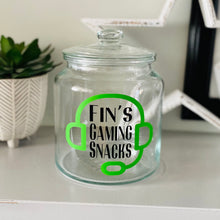 Load image into Gallery viewer, personalised gaming snack jar with lid, headphone image with name&#39;s gaming snacks on the front
