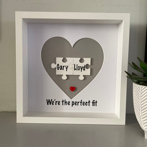 box framed personalised gift with 2 jigsaw pieces with names on we're the perfect fit underneath