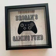 Load image into Gallery viewer, personalised gaming fund money box in a frame with controller image
