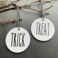 Load image into Gallery viewer, white bauble with black string and the word trick or treat
