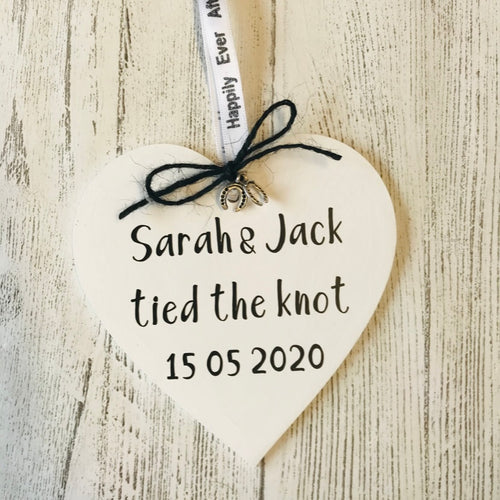 cream tied the knot hanging heart personalised with couples names with black bow