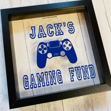 Load image into Gallery viewer, personalised gaming fund money box in a frame with controller image
