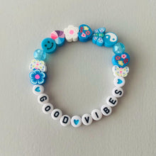 Load image into Gallery viewer, bright coloured mixed beaded elasticated bracelet with the words good vibes 
