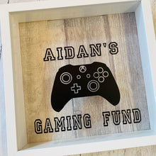 Load image into Gallery viewer, personalised gaming fund money box in a frame with controller image
