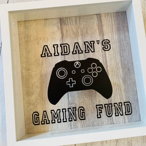 personalised gaming fund money box in a frame with controller image