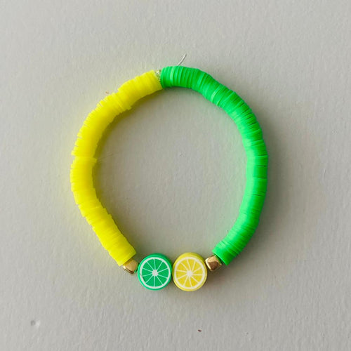 lemon and lime bead elasticated bracelet with a lemon and lime slice bead