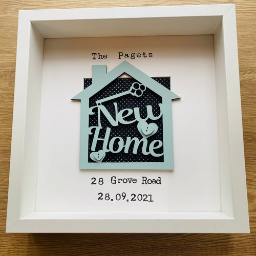 personalised new home gift within a frame with new home text and family name