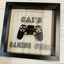 Load image into Gallery viewer, personalised gaming fund money box in a frame with controller image
