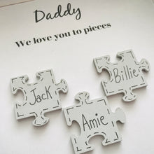 Load image into Gallery viewer, box frame with names on jigsaw pieces and daddy/mummy we love you to pieces
