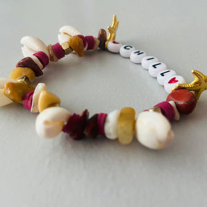 bracelet brown and cream with shells and word chill