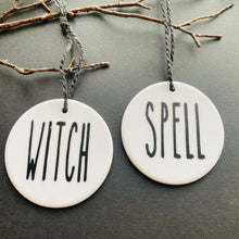 Load image into Gallery viewer, white bauble with black string and the word witch and spell
