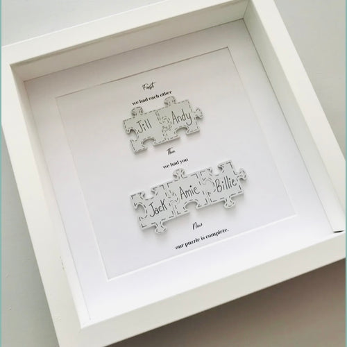 jigsaw piece family in frame with names on jigsaw pieces