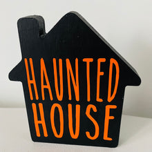 Load image into Gallery viewer, freestanding wooden house halloween decoration with haunted house text on front
