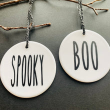 Load image into Gallery viewer, white bauble with black string and the word spooky or boo
